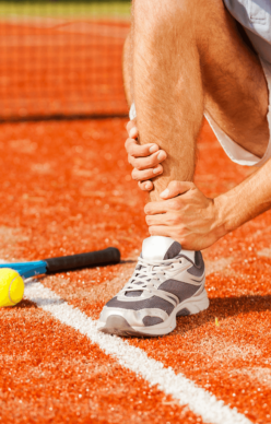 Sports-Injury-Rehabilitation An Injured Athlete needing medical attention